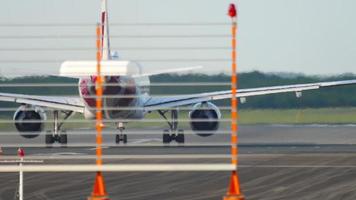 DUSSELDORF, GERMANY JULY 21, 2017 - Eurowings Airbus 320 D AEWW airliner starting to run for take off fromDusseldorf airport. View from behind landing lights masts. video