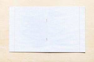 blank open school notebook with squared sheets photo