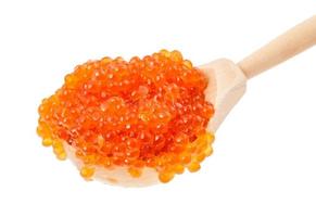 big wooden spoon with salted russian red caviar photo