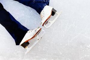 white leather skates on ice photo