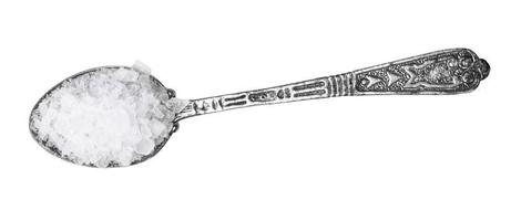 top view of silver salt spoon with coarse Sea Salt photo