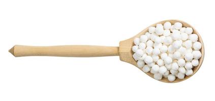 top view of tapioca pearls in wood spoon isolated photo