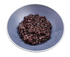 boiled black rice in gray bowl isolated on white photo