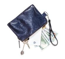 purse with phone, keys, cards and dollars isolated photo