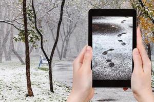 picture footprints in first snow in urban park photo