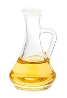 glass jug with vegetable oil isolated on white photo
