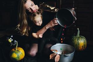 mother and daughter playing together at home photo