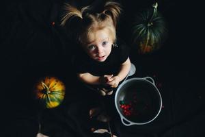 little girl playing in a witch photo