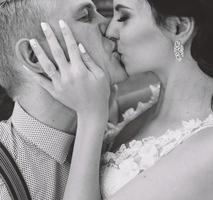 Wedding couple kiss each other photo