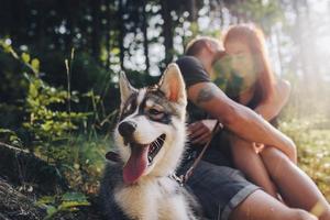 beautiful couple resting in the forest photo