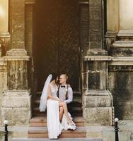 Bride sitting on lap of the bride photo