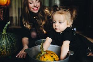 mother and daughter playing together at home photo