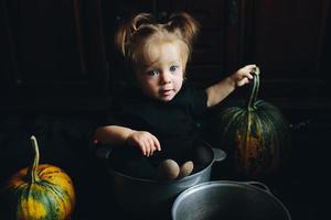 little girl playing in a witch photo