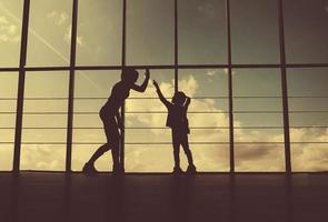 Silhouette of mother and daughter in the gym photo