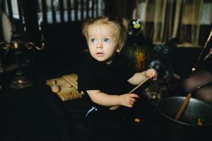 little girl playing in a witch photo