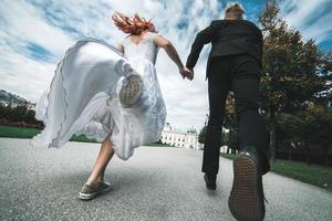 Wedding couple on a walk in the estate of the Belvedere in Vienna photo