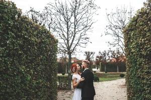 Wedding couple on a walk in a beautiful park in the city of Vienna photo