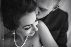 Beautiful European bridal couple in the hotel room photo