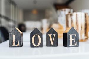 Word Love on wooden cubes, close-up. Valentine concept photo