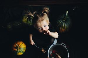 little girl playing in a witch photo