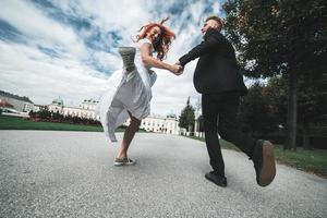 Wedding couple on a walk in the estate of the Belvedere in Vienna photo