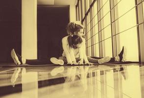Mother and daughter makeing yoga in the gym photo