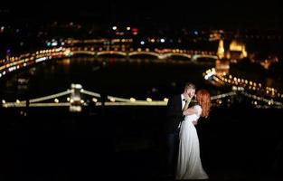 Lovely bride and groom on a background of Budapest photo