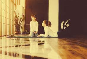 Two girls of different ages makeing yoga photo