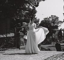 Bride posing in city photo