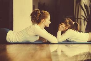 Mother and daughter have fun in the gym photo