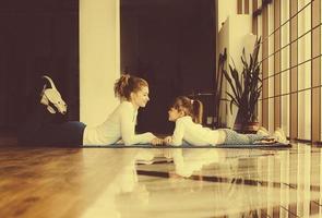 Mother and daughter have fun in the gym photo