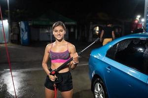 Preparing for car cleaning in a car wash. High Pressure Car Washing. photo