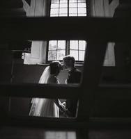 bride and groom on the background of a window. photo