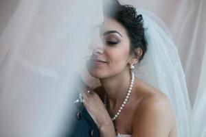 Beautiful European bridal couple in the hotel room photo