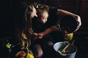 mother and daughter playing together at home photo