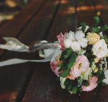 Wedding bouquet on a bench photo