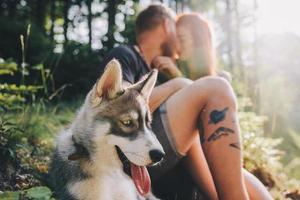 beautiful couple resting in the forest photo