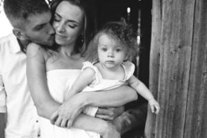 mother, father and daughter together having fun photo