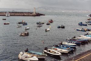 Berth with boats on sea shore photo