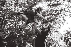 Dad and little daughter have fun and playing photo