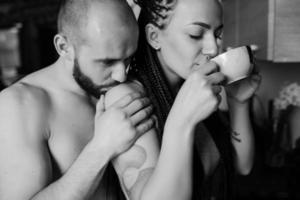 man and woman in the kitchen photo