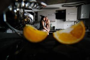 man and woman in the kitchen photo