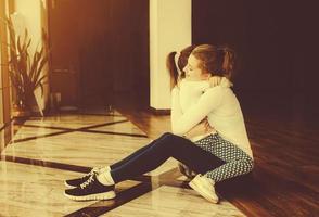 Mother and daughter hugging in the gym photo