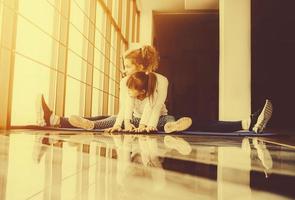 Mother and daughter have fun in the gym photo