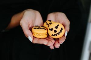 woman holding a biscuit for Halloween photo