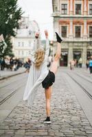 beautiful young girl lifted her leg up photo