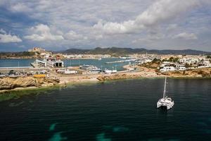 Aerial view on catamaran and port on the background. photo