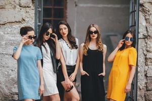 Five young beautiful girls in the city photo