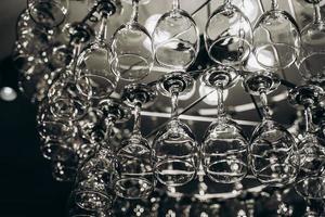 Beautiful chandelier made with glasses of wine photo