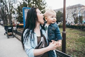 Young mother with her baby boy photo